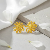 MoodStanBohoFlowerGoldEarringStudwhiteclothandconcreteslab