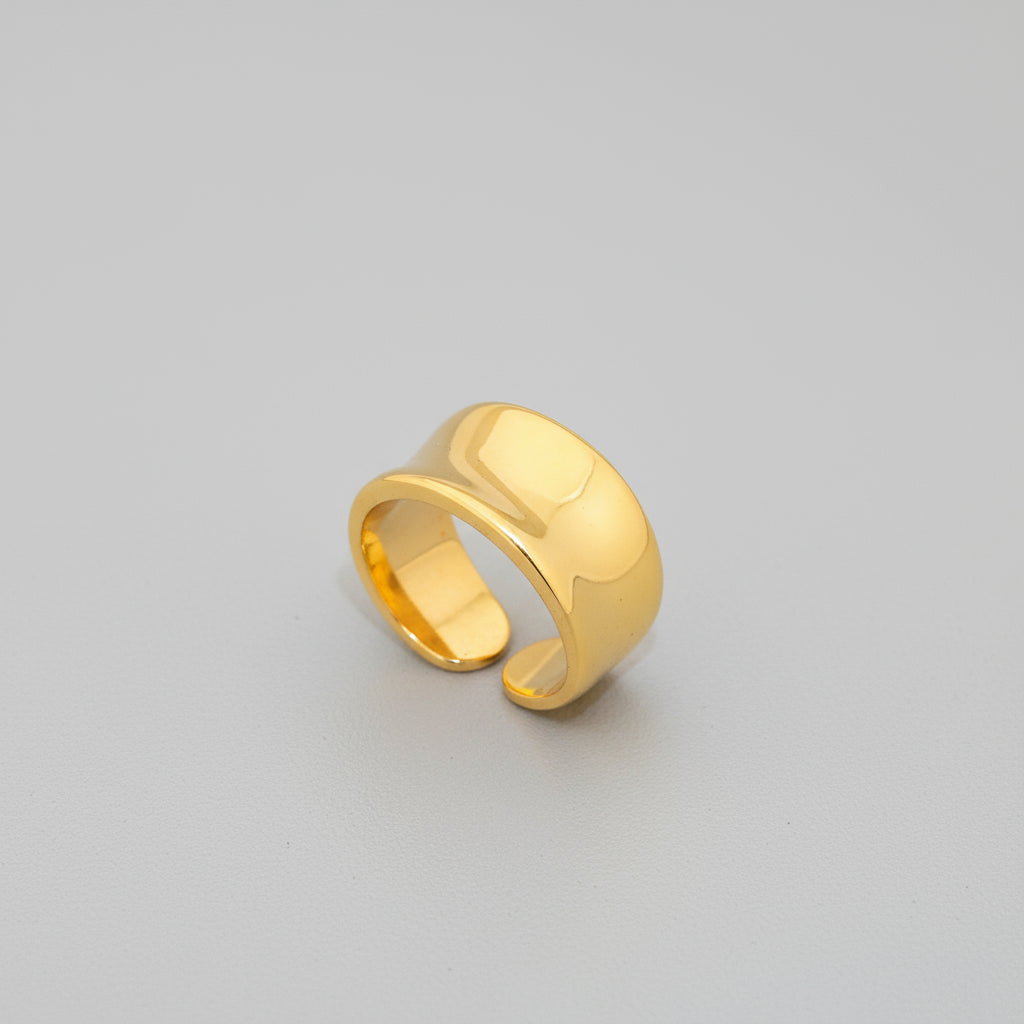 Gold ring on a white background
