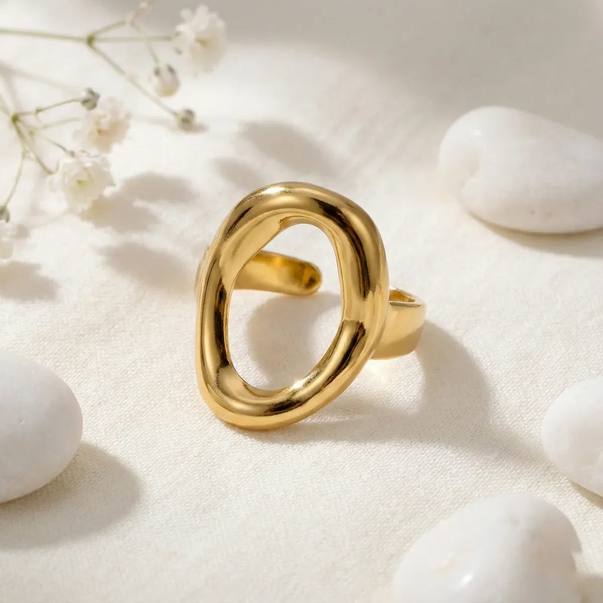 Geometric oval statement golden ring on soft fabric