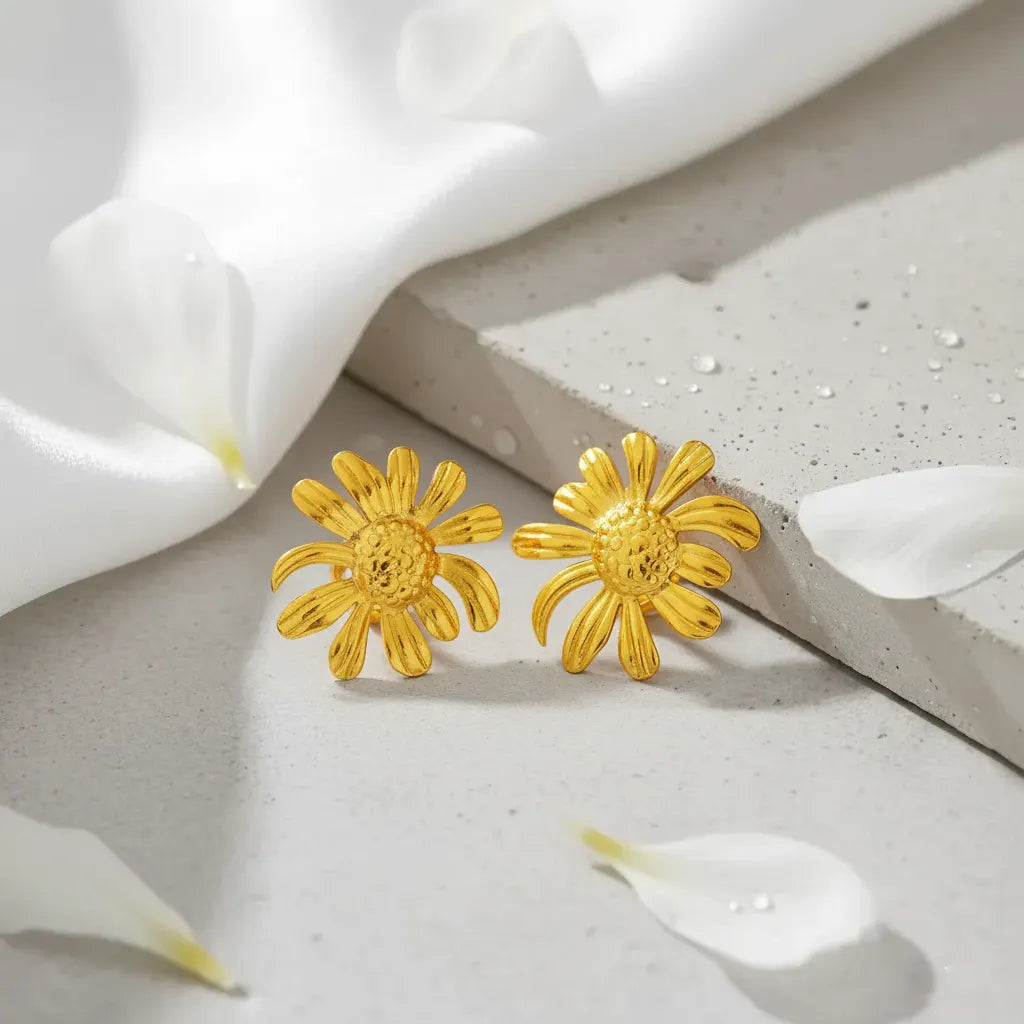 MoodStanBohoFlowerGoldEarringStudwhiteclothandconcreteslab