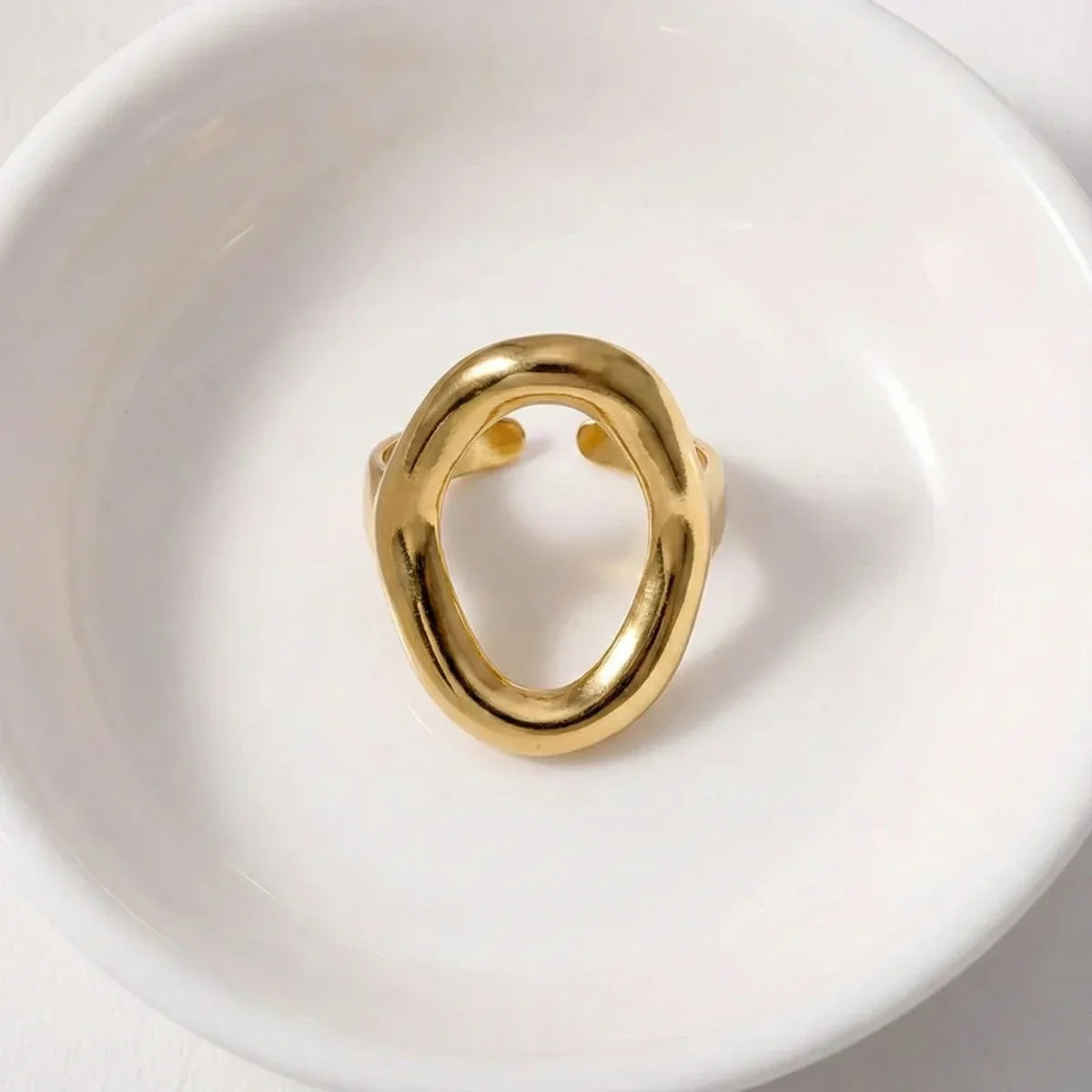 Geometric oval golden ring minimalist top view