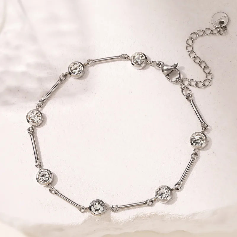 Silver bracelet with crystal beads on a light background