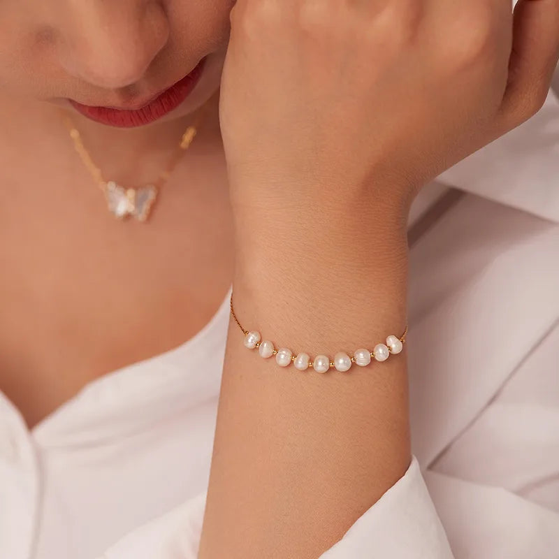 Pearl bracelet on a wrist with a soft background