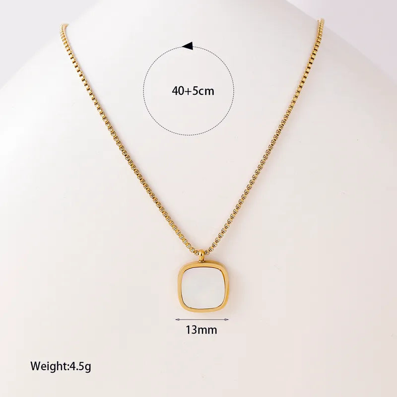 Gold necklace with a square pendant on a white background, showing measurements.