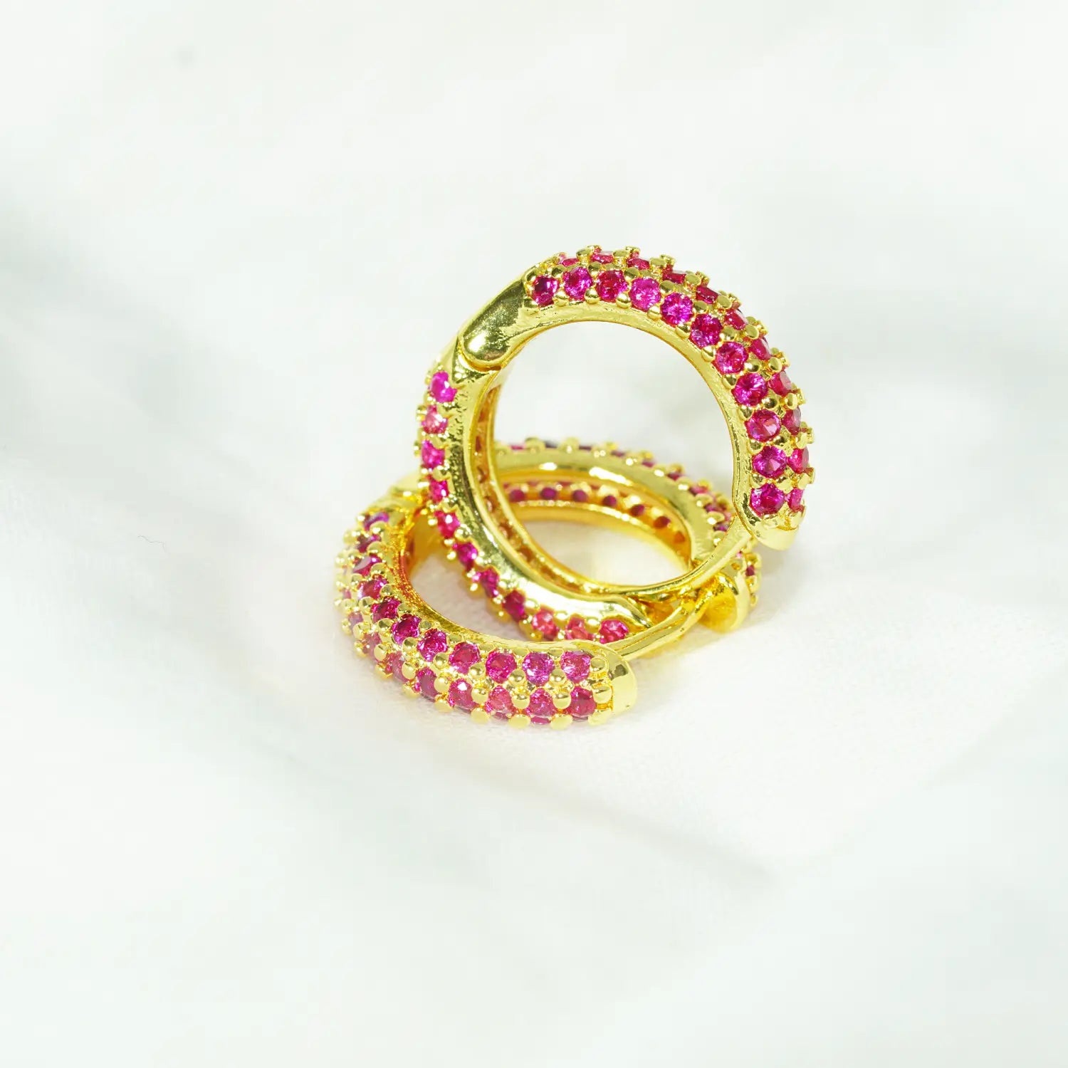 MoodStan gold plated stainless steel hoop earrings closeup - pink and gold huggie style fashion jewelry for women - waterproof and hypoallergenic