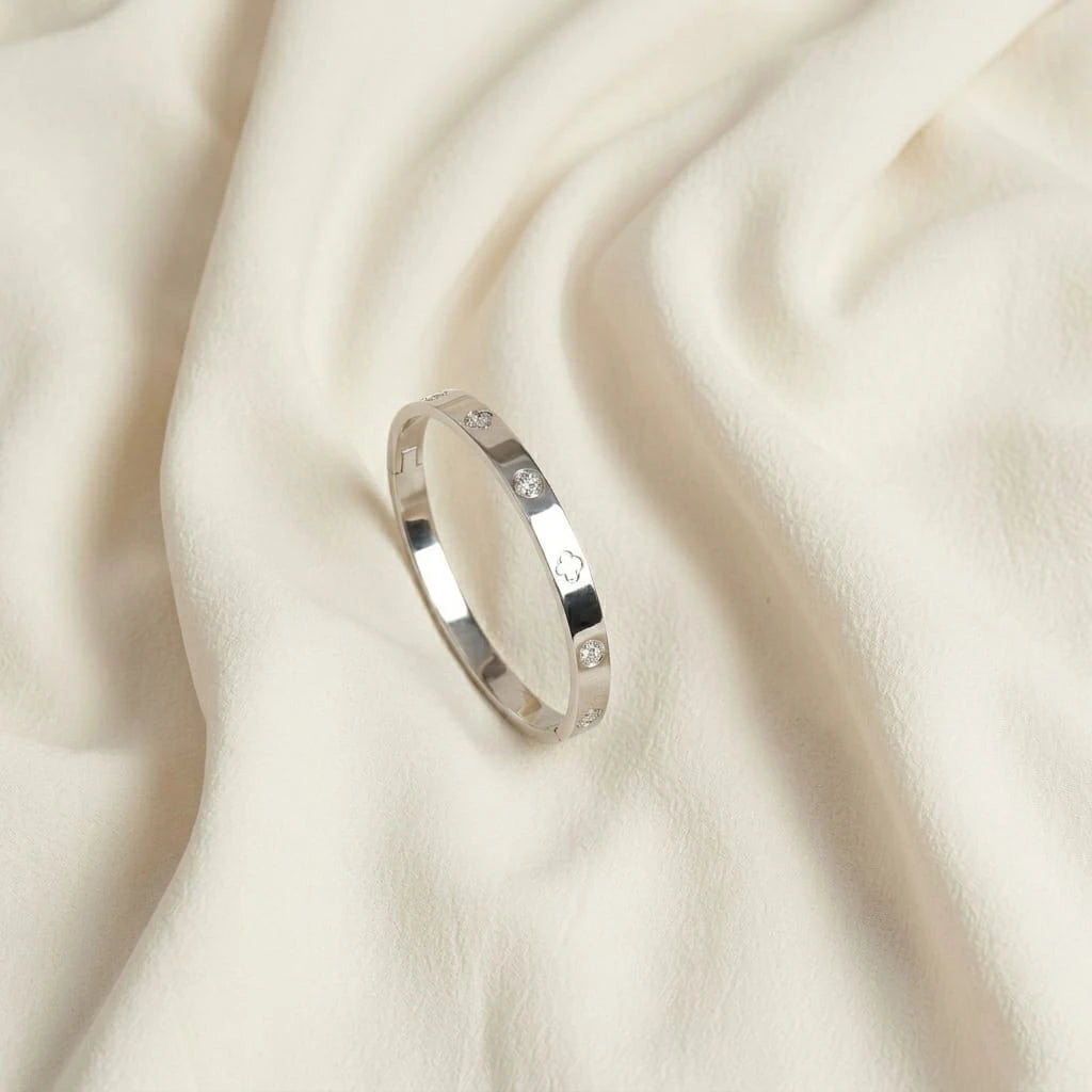 Silver ring with small stones on a beige fabric background